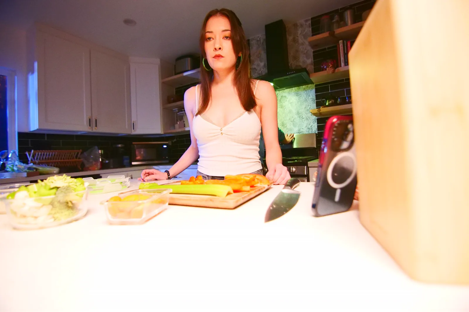 Kelly Lou Dennis at the kitchen counter during a take