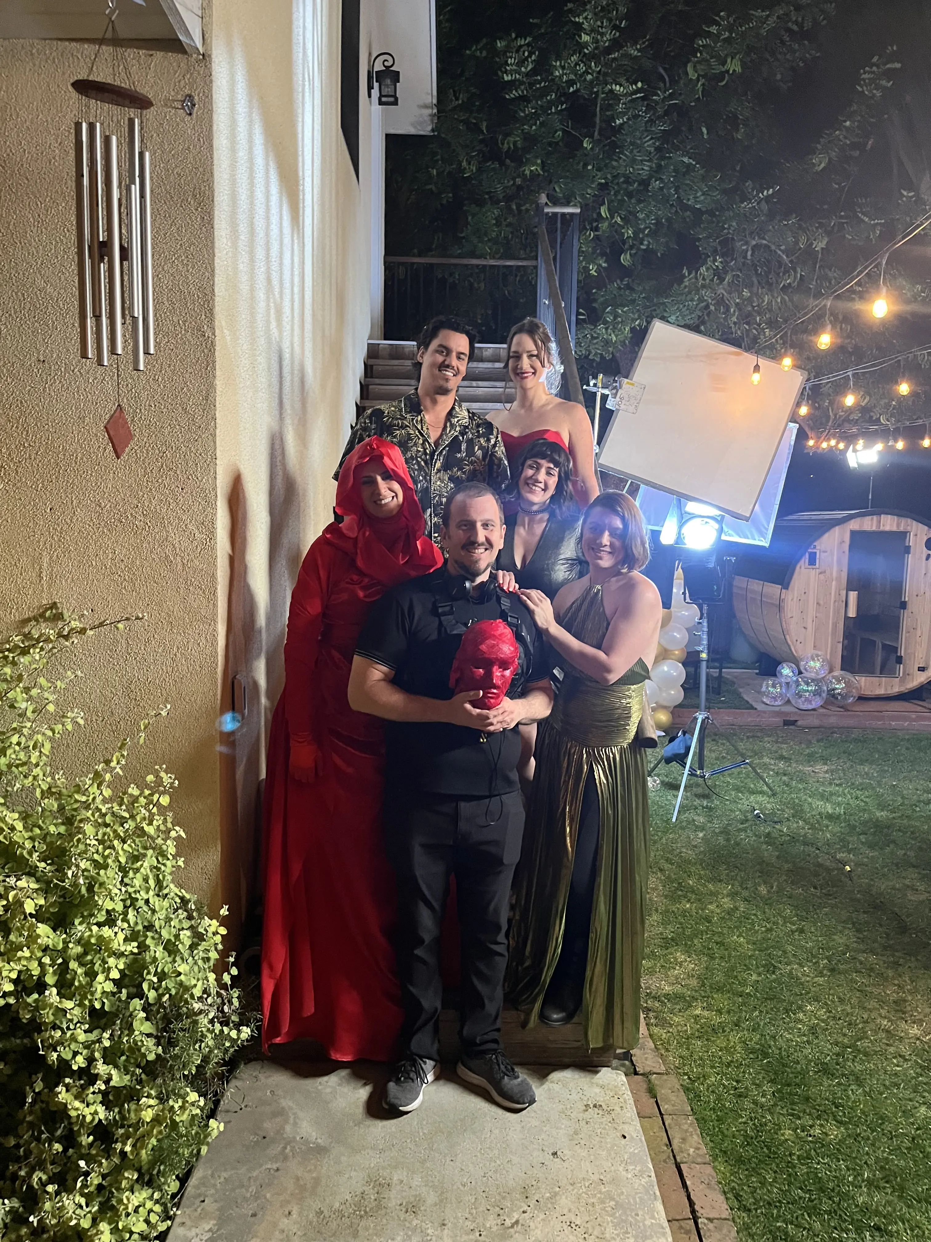 The Inhabitant cast gathered outdoors during a night shoot
